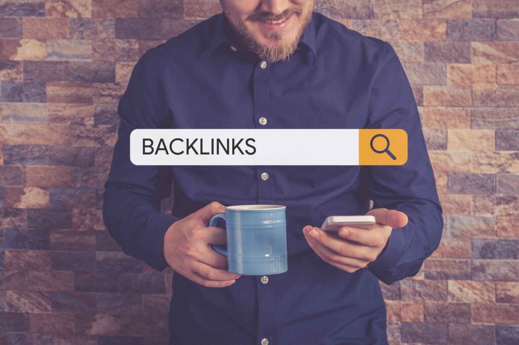 A man searching for backlinks on his phone with a coffee in hand.